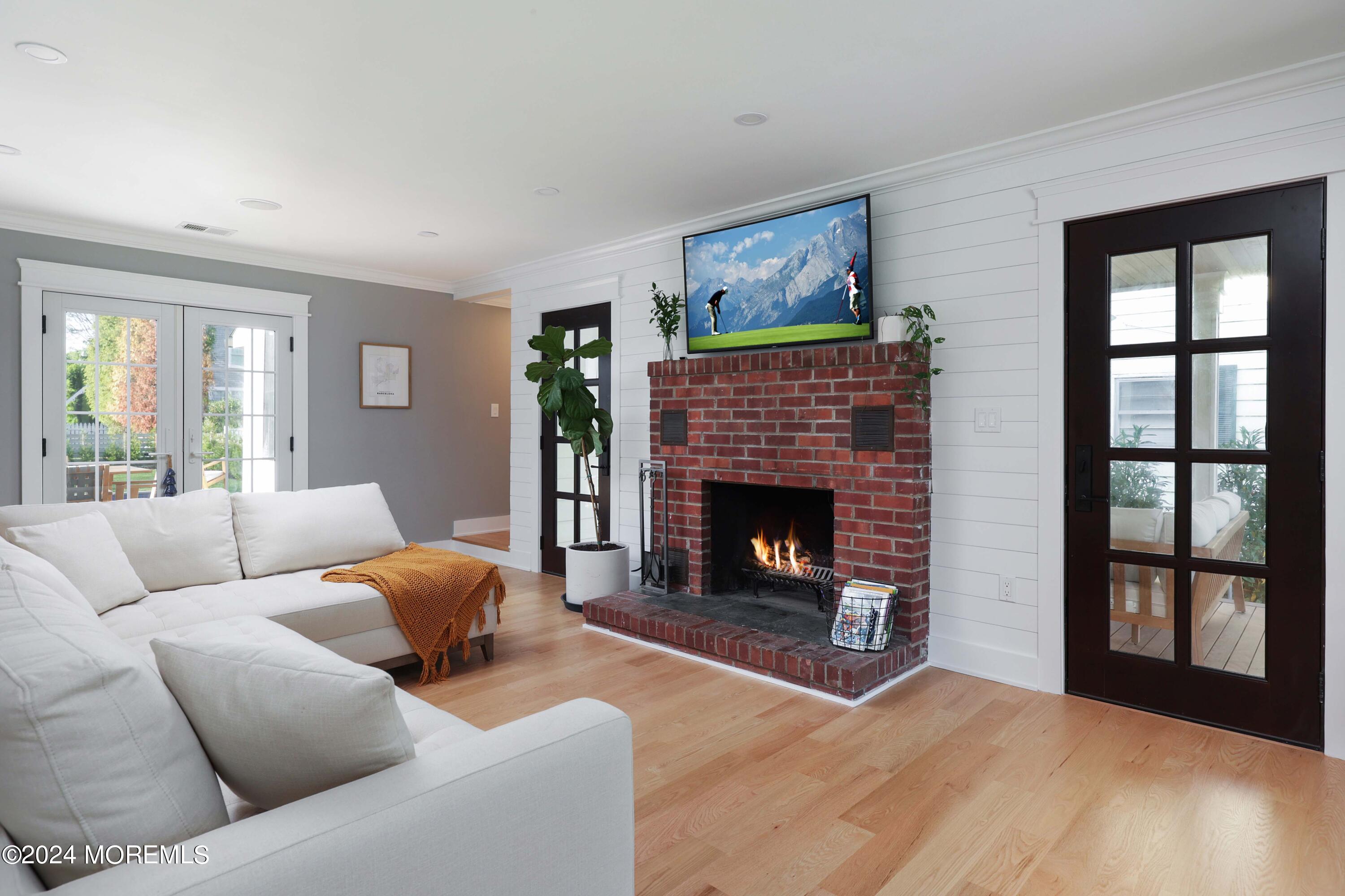 408 Central Avenue Spring Lake, NJ 07762 - Photo 16 of 46 a living room with furniture and a fireplace