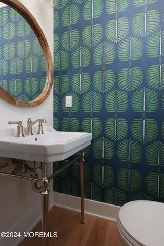 a bathroom with a sink and mirror