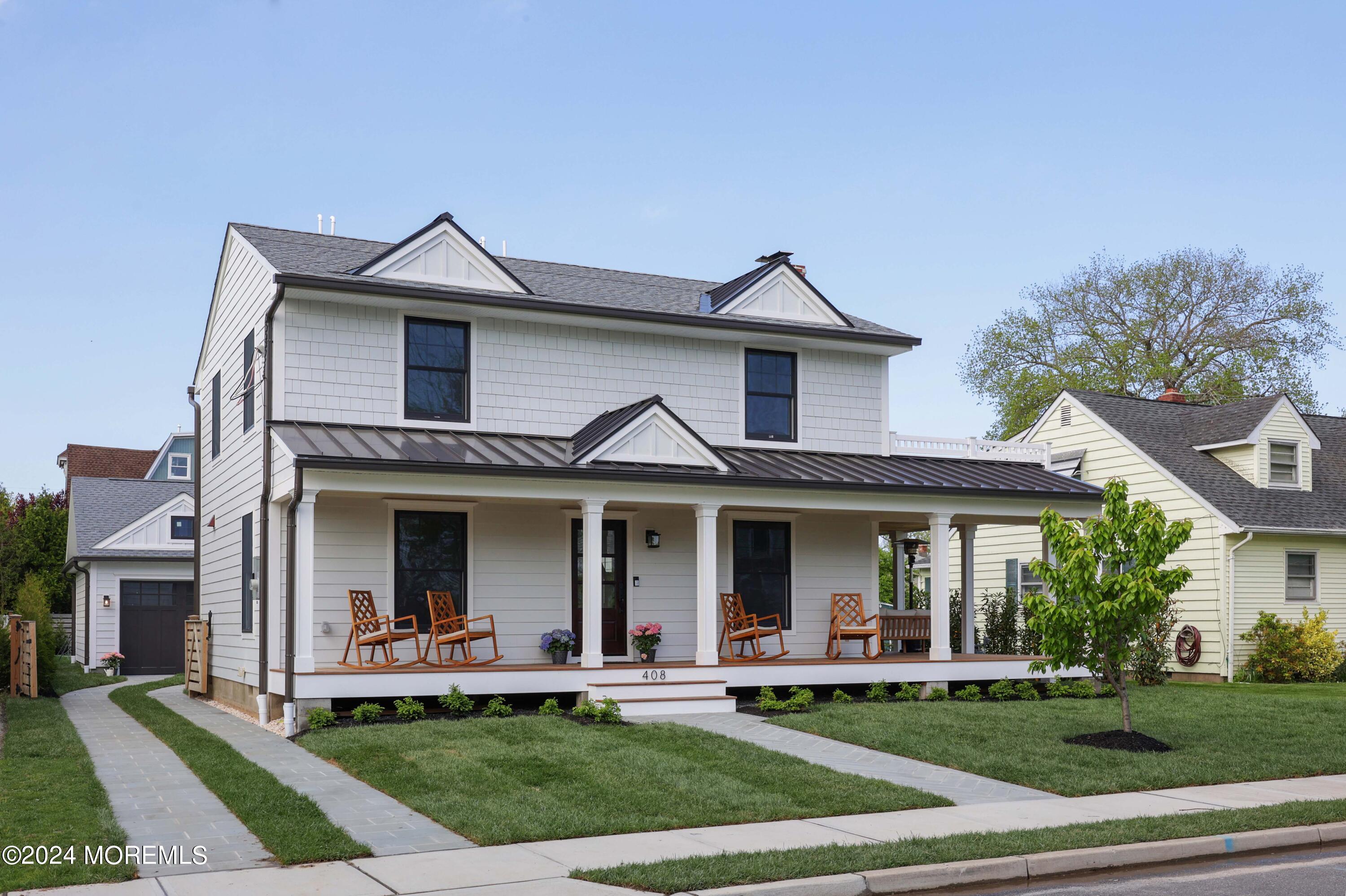 408 Central Avenue Spring Lake, NJ 07762 - Photo 2 of 46 a front view of a house with a yard