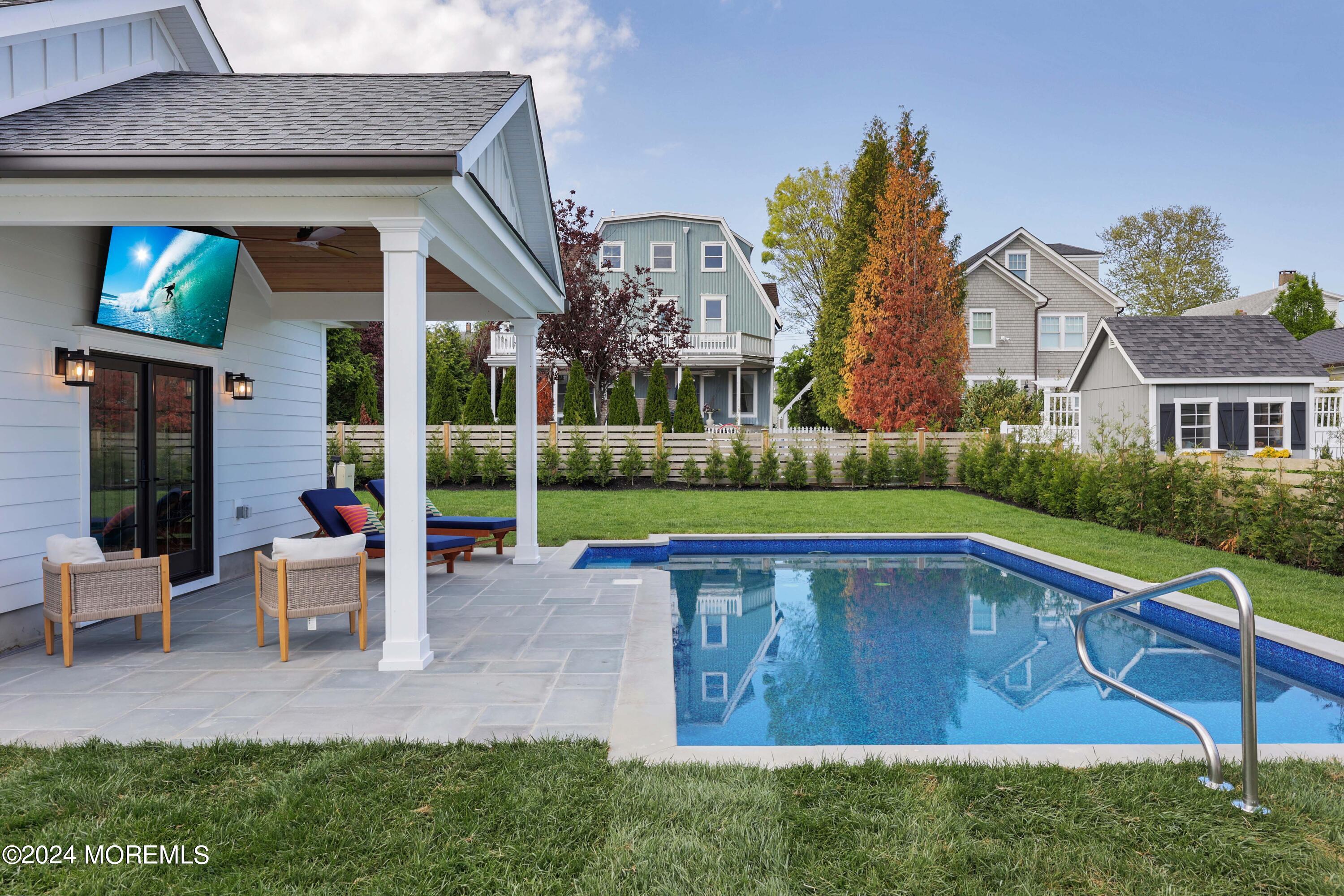408 Central Avenue Spring Lake, NJ 07762 - Photo 34 of 46 a view of a house with a swimming pool
