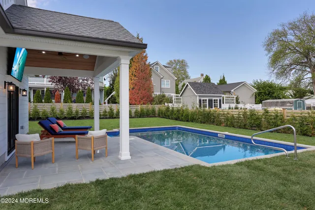 a view of a house with a yard porch and sitting area