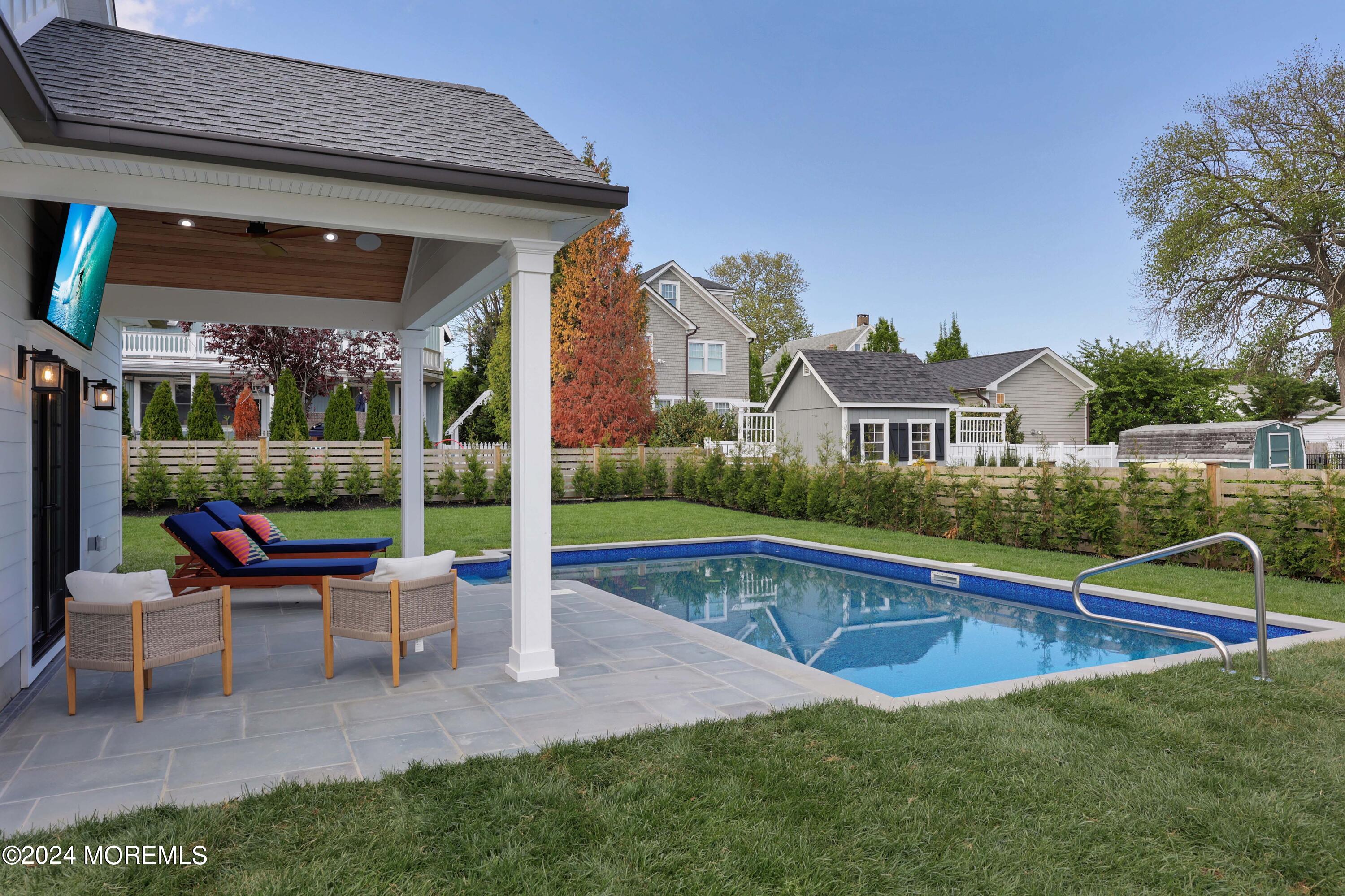 408 Central Avenue Spring Lake, NJ 07762 - Photo 35 of 46 a view of a house with a yard porch and sitting area