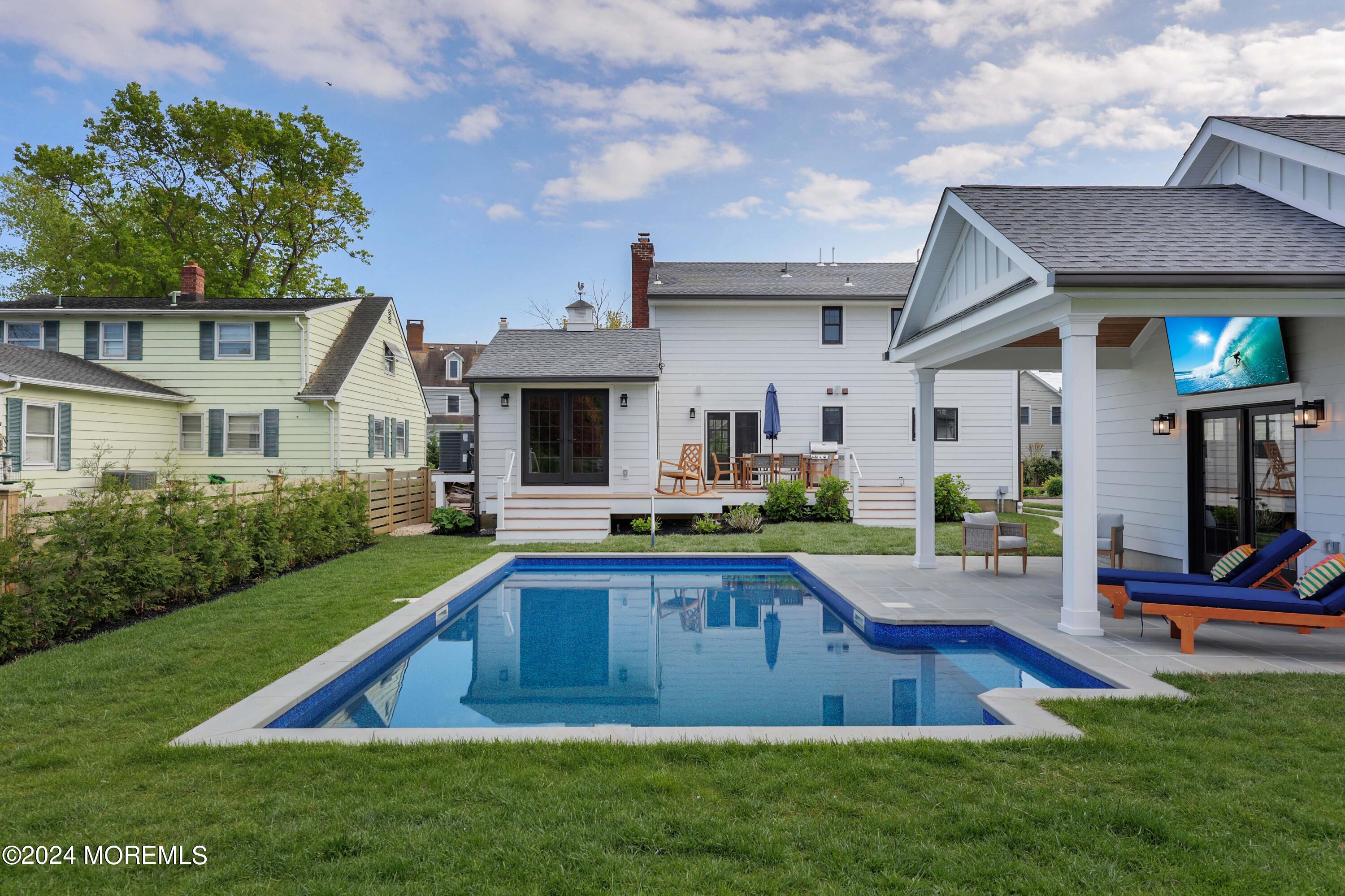 408 Central Avenue Spring Lake, NJ 07762 - Photo 38 of 46 a view of a house with swimming pool and a yard