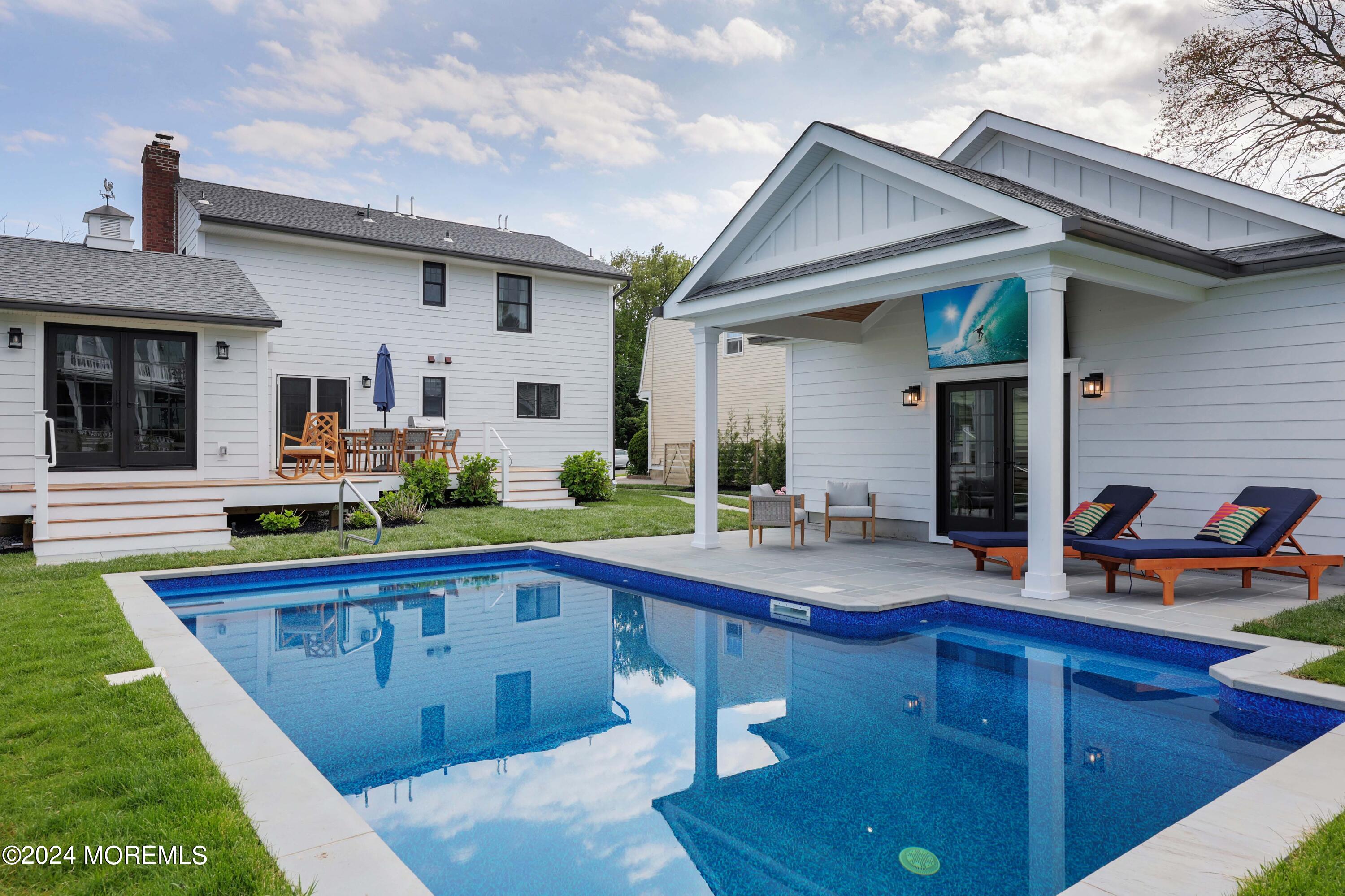408 Central Avenue Spring Lake, NJ 07762 - Photo 39 of 46 a swimming pool view with a outdoor seating