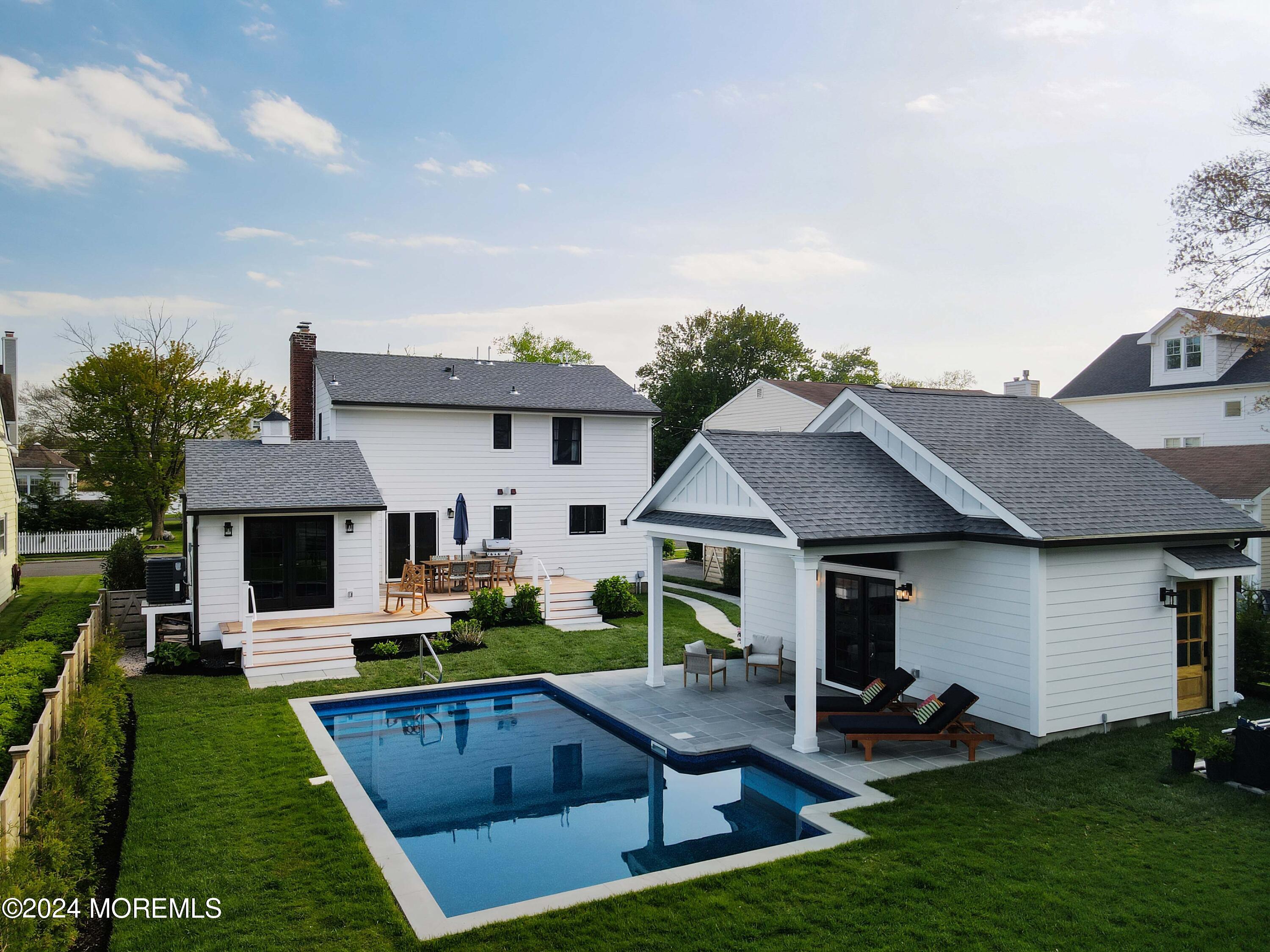 408 Central Avenue Spring Lake, NJ 07762 - Photo 42 of 46 a view of house with garden and tall trees