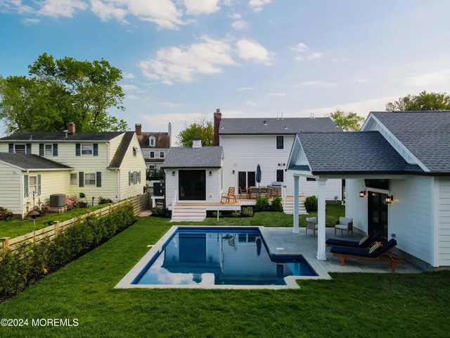 a front view of house with yard and outdoor seating