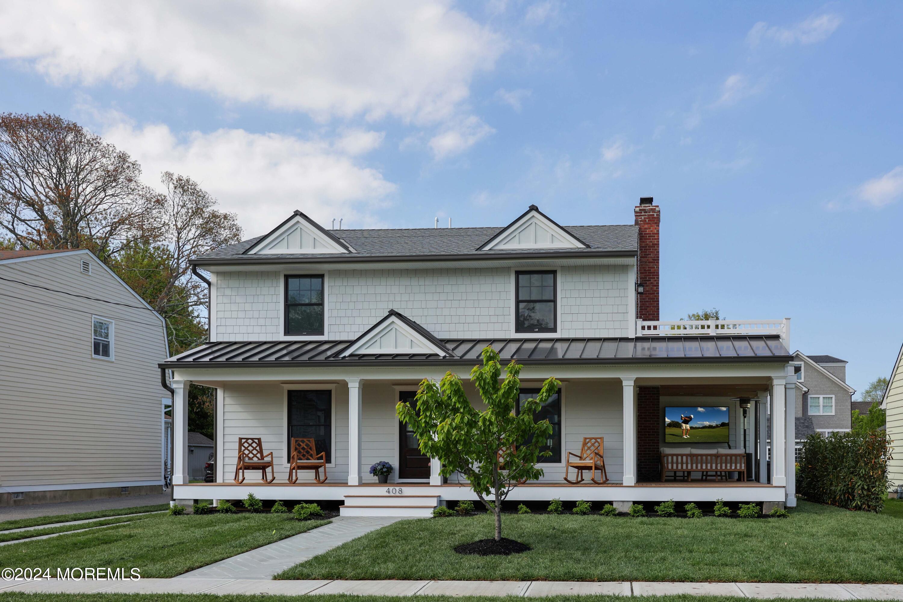 408 Central Avenue Spring Lake, NJ 07762 - Photo 5 of 46 a front view of a house with garden