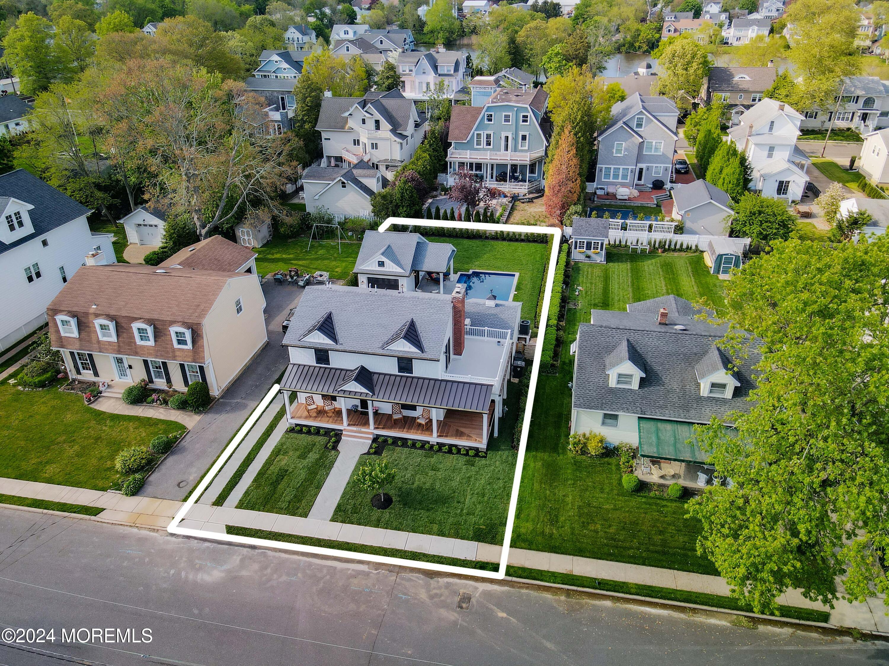 408 Central Avenue Spring Lake, NJ 07762 - Photo 6 of 46 an aerial view of multiple houses with a yard
