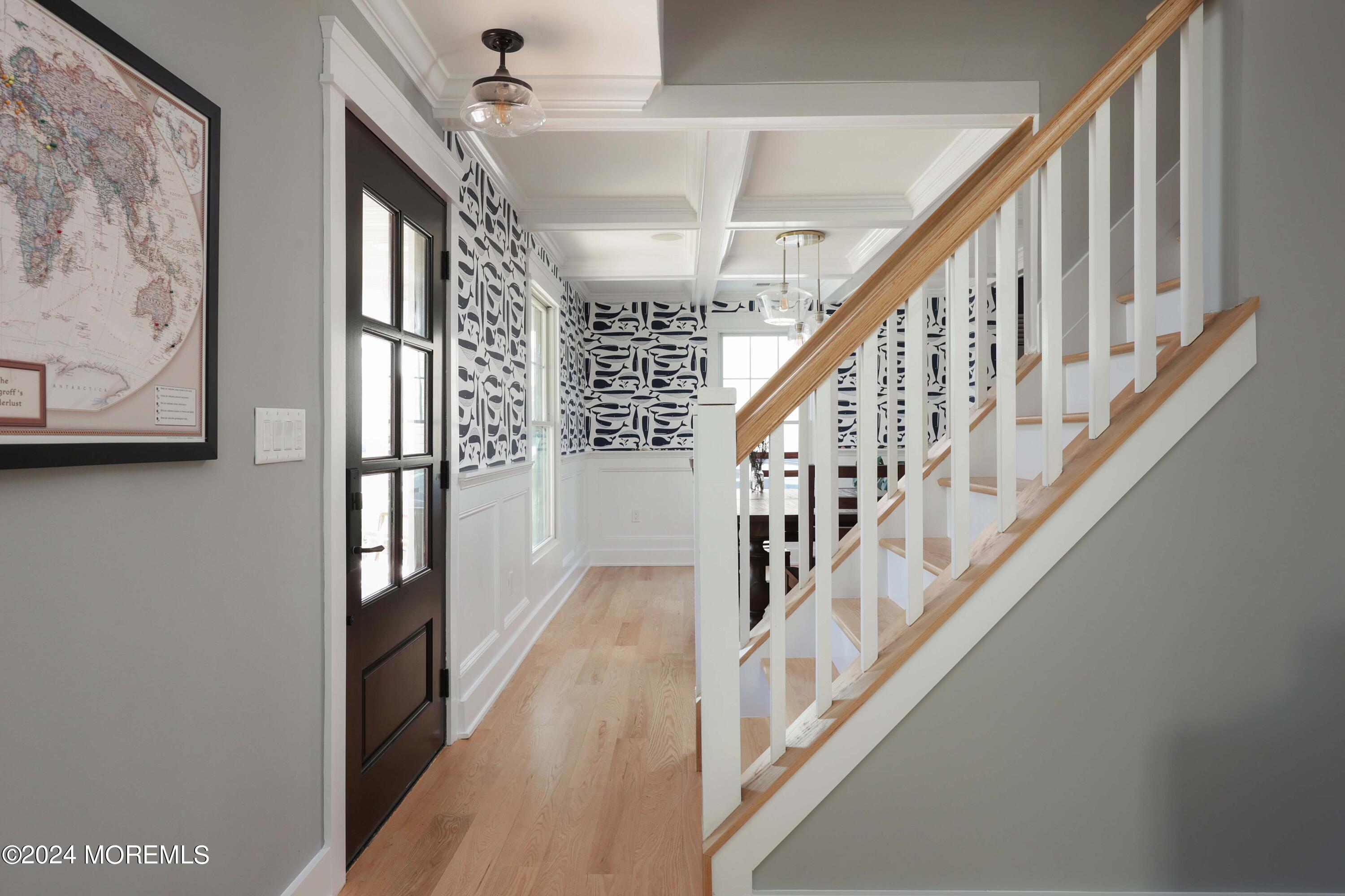 408 Central Avenue Spring Lake, NJ 07762 - Photo 9 of 46 a view of staircase with lots of frames on wall and a window