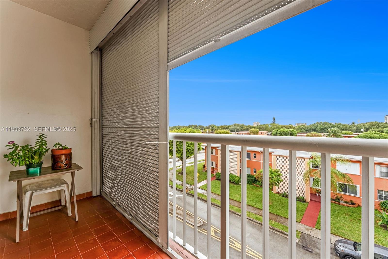 a view of a balcony with furniture