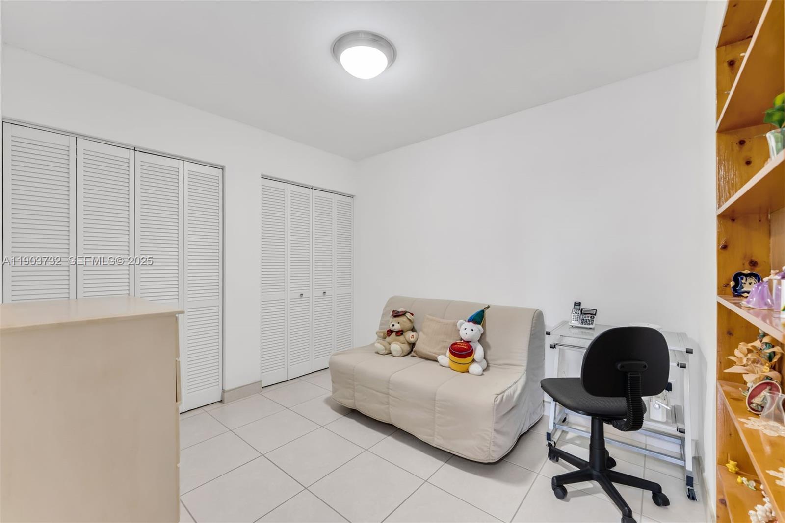 3661 Southwest 9th Terrace, Unit 402 Miami, FL 33135 - Photo 11 of 15 a bedroom with a bed and a window