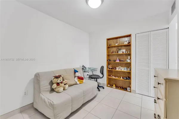 a bedroom with a bed and a cabinets