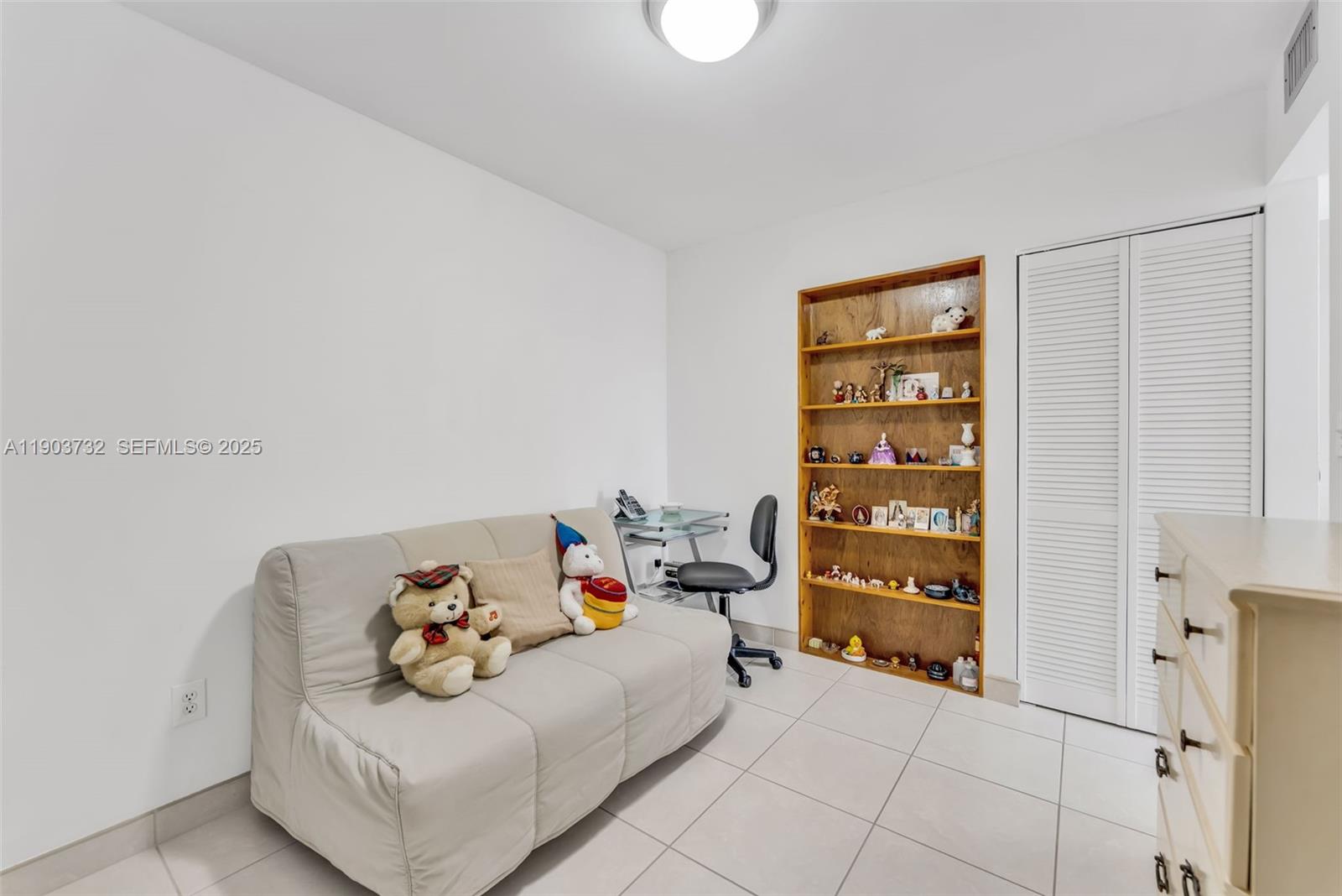 3661 Southwest 9th Terrace, Unit 402 Miami, FL 33135 - Photo 12 of 15 a bedroom with a bed and a cabinets