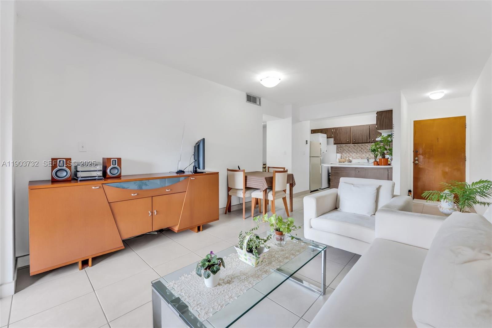 3661 Southwest 9th Terrace, Unit 402 Miami, FL 33135 - Photo 7 of 15 a living room with furniture