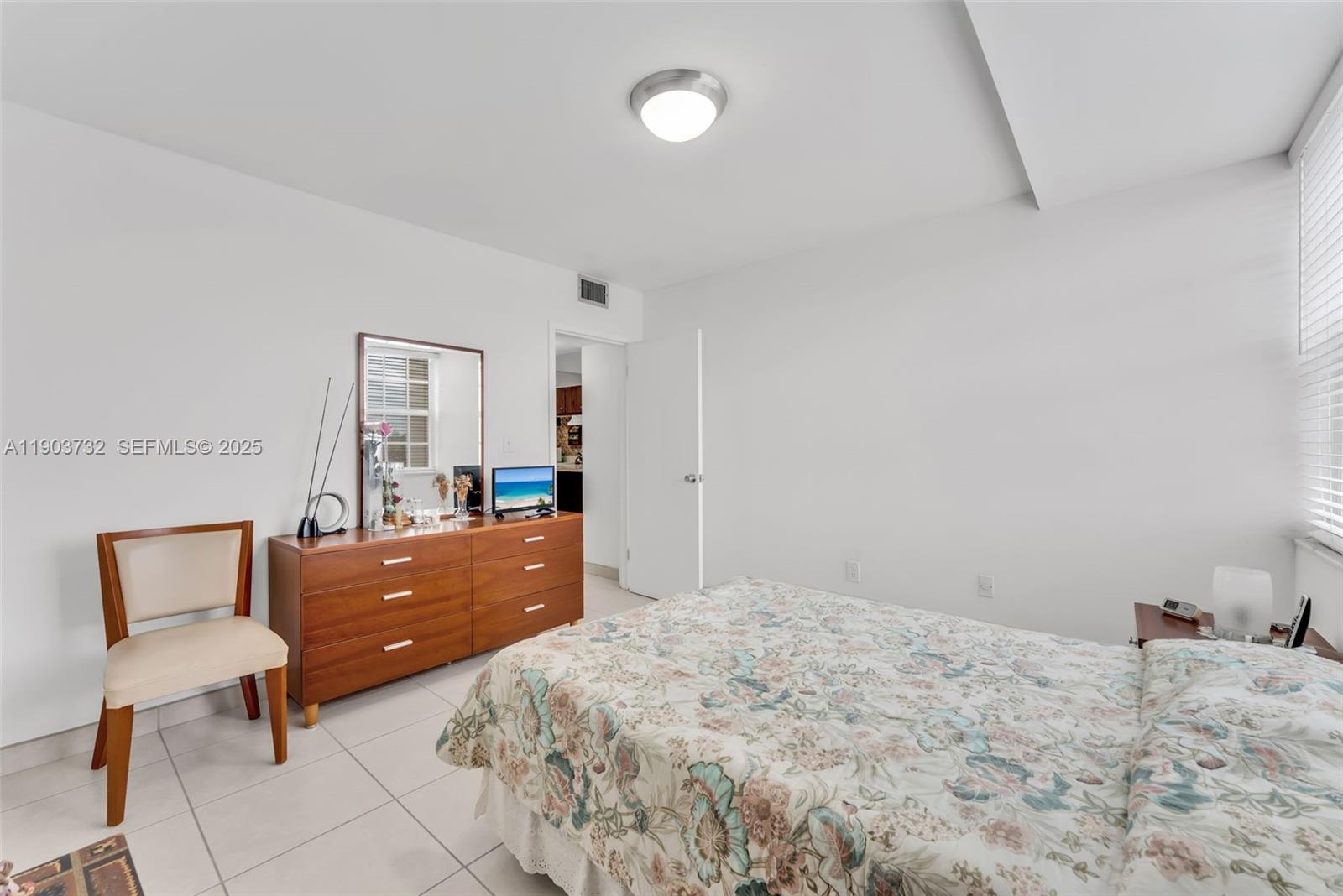 3661 Southwest 9th Terrace, Unit 402 Miami, FL 33135 - Photo 9 of 15 a bedroom with a bed and window