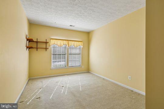 9511 Kingscroft Terrace, Unit 9511F Perry Hall, MD 21128 - Photo 34 of 38 a view of an empty room with a window