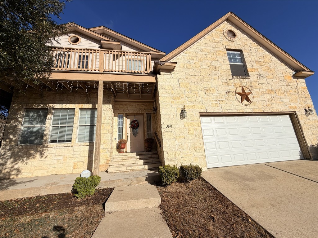 3811 Hawk View Street Round Rock, TX 78665 - Photo 2 of 6 a front view of a house with a yard