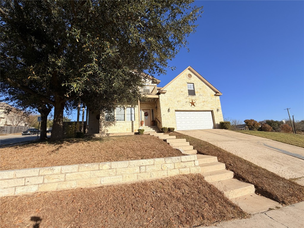 3811 Hawk View Street Round Rock, TX 78665 - Photo 3 of 6 a front view of a house with a yard