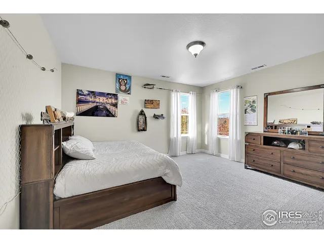 a bedroom with furniture and window
