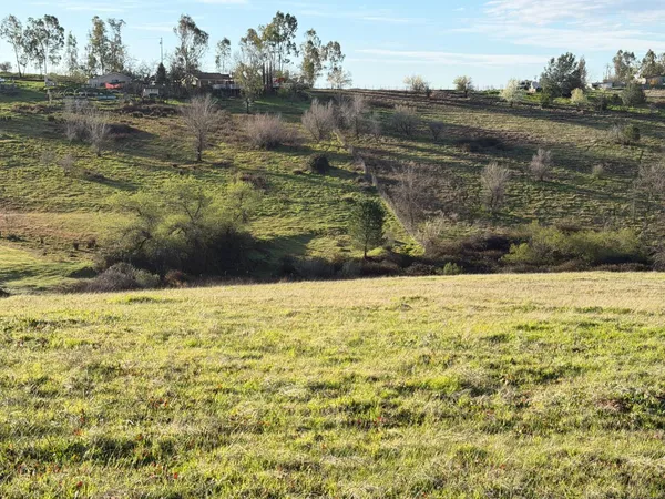 a view of a lake with a big yard