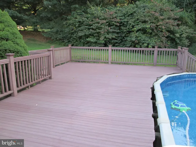 a front view of a house with a garden and yard