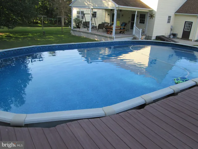 a view of house with a yard