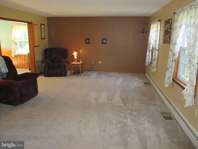 a kitchen with a sink cabinets and dining table