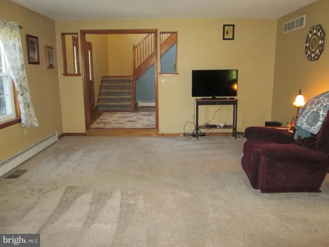 a kitchen with a refrigerator and a stove