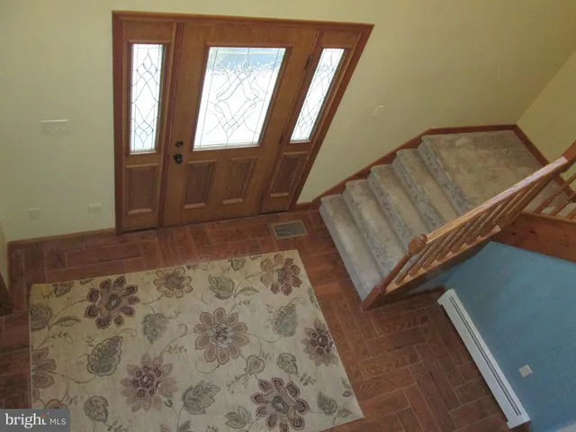 a spacious bedroom with a bed and a window