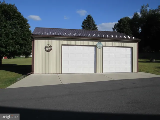a front view of a house with yard