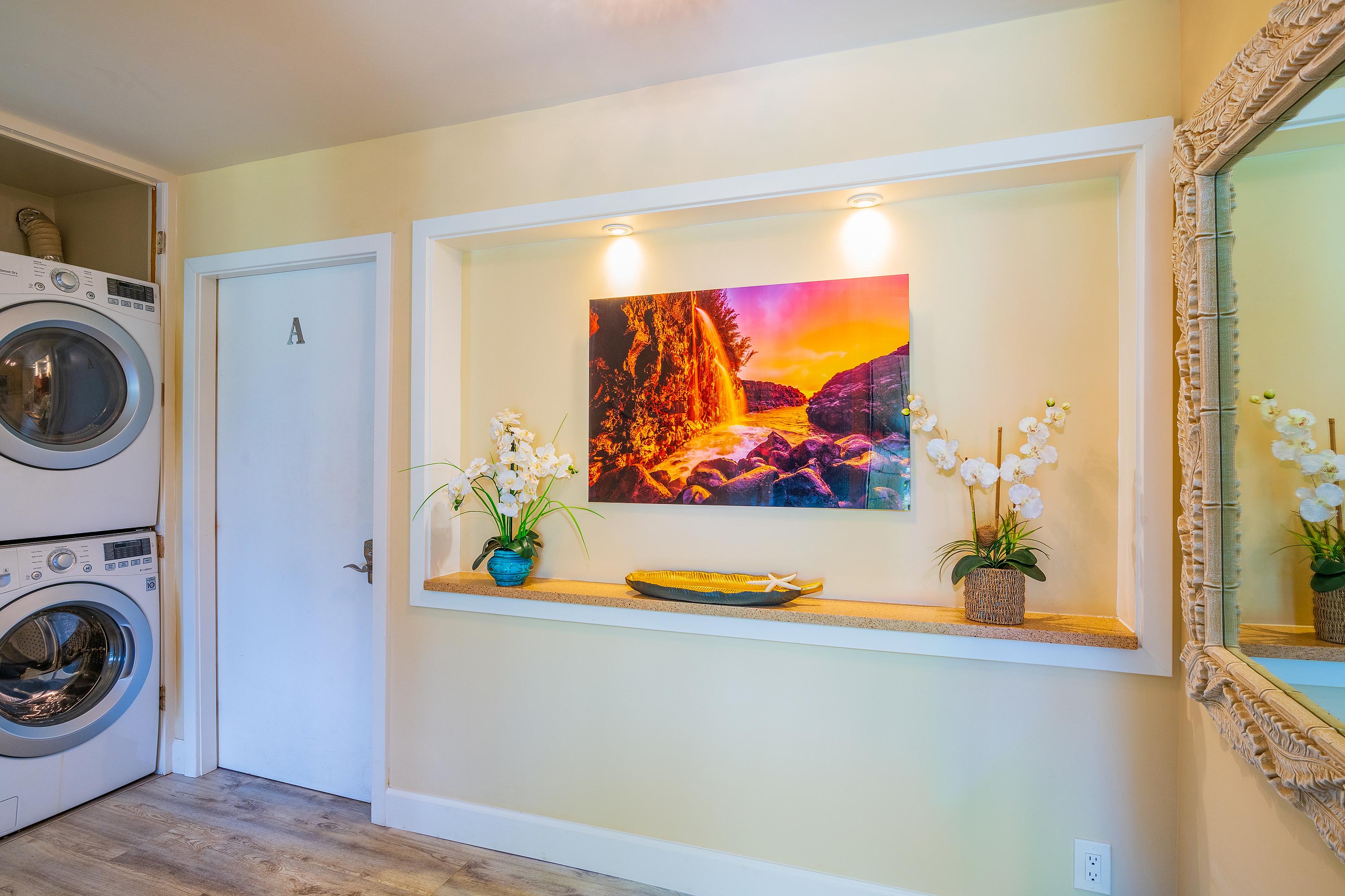 3811 Edward Road, Unit 2309 Princeville, HI 96722 - Photo 13 of 27 a view of a living room with washer and dryer
