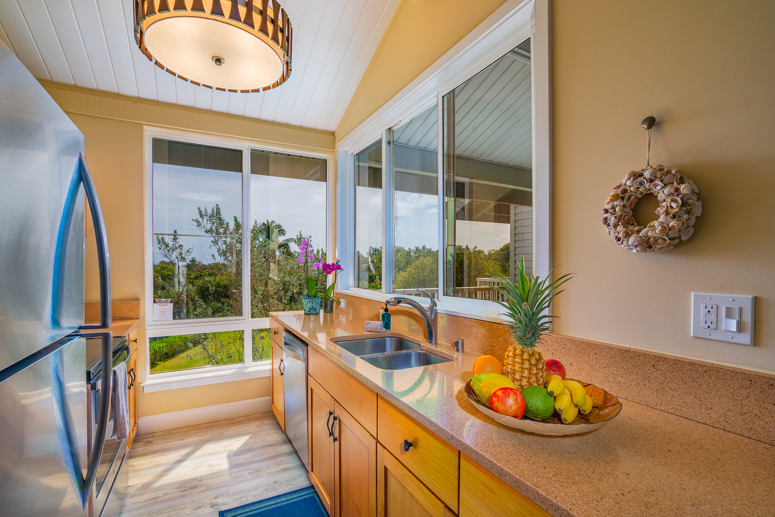 3811 Edward Road, Unit 2309 Princeville, HI 96722 - Photo 3 of 27 a view of a house and a swimming pool