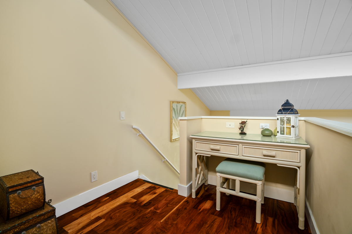3811 Edward Road, Unit 2309 Princeville, HI 96722 - Photo 8 of 27 a view of a livingroom with furniture and wooden floor