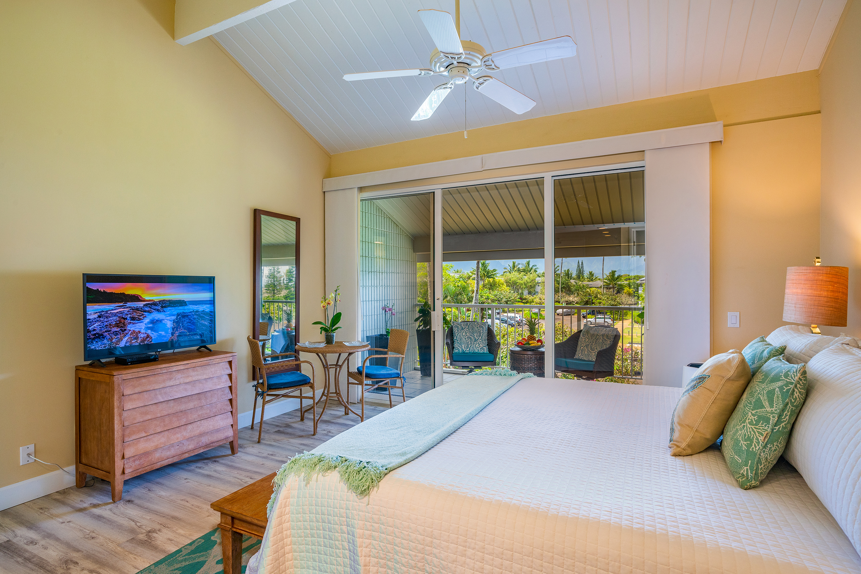 3811 Edward Road, Unit 2309 Princeville, HI 96722 - Photo 9 of 27 a bed room with furniture and a large window