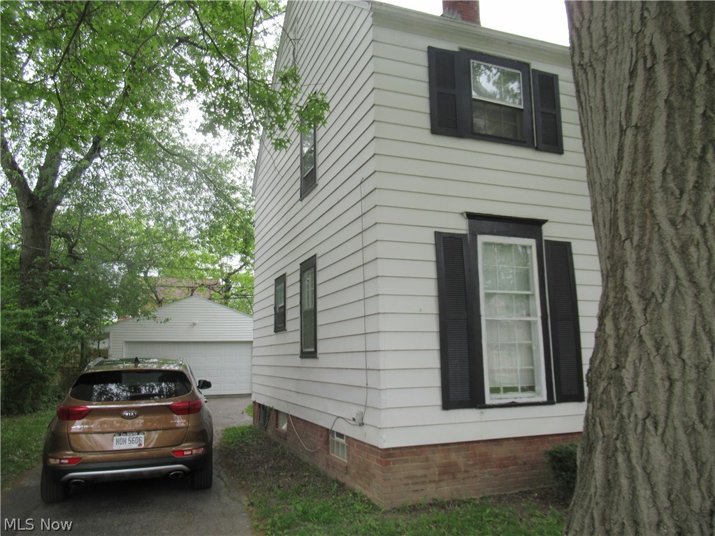 3824 East Antisdale Road Cleveland, OH 44118 - Photo 2 of 27 White horizontal siding exterior with black window shutters