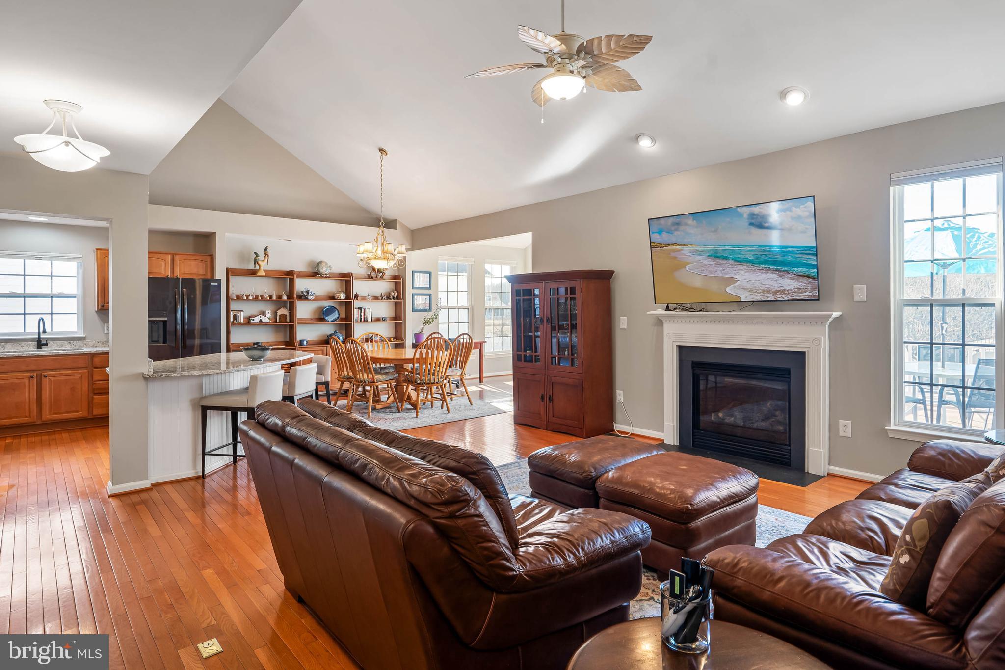 37140 Lord Baltimore Lane Ocean View, DE 19970 - Photo 15 of 56 a living room with furniture a fireplace and wooden floor