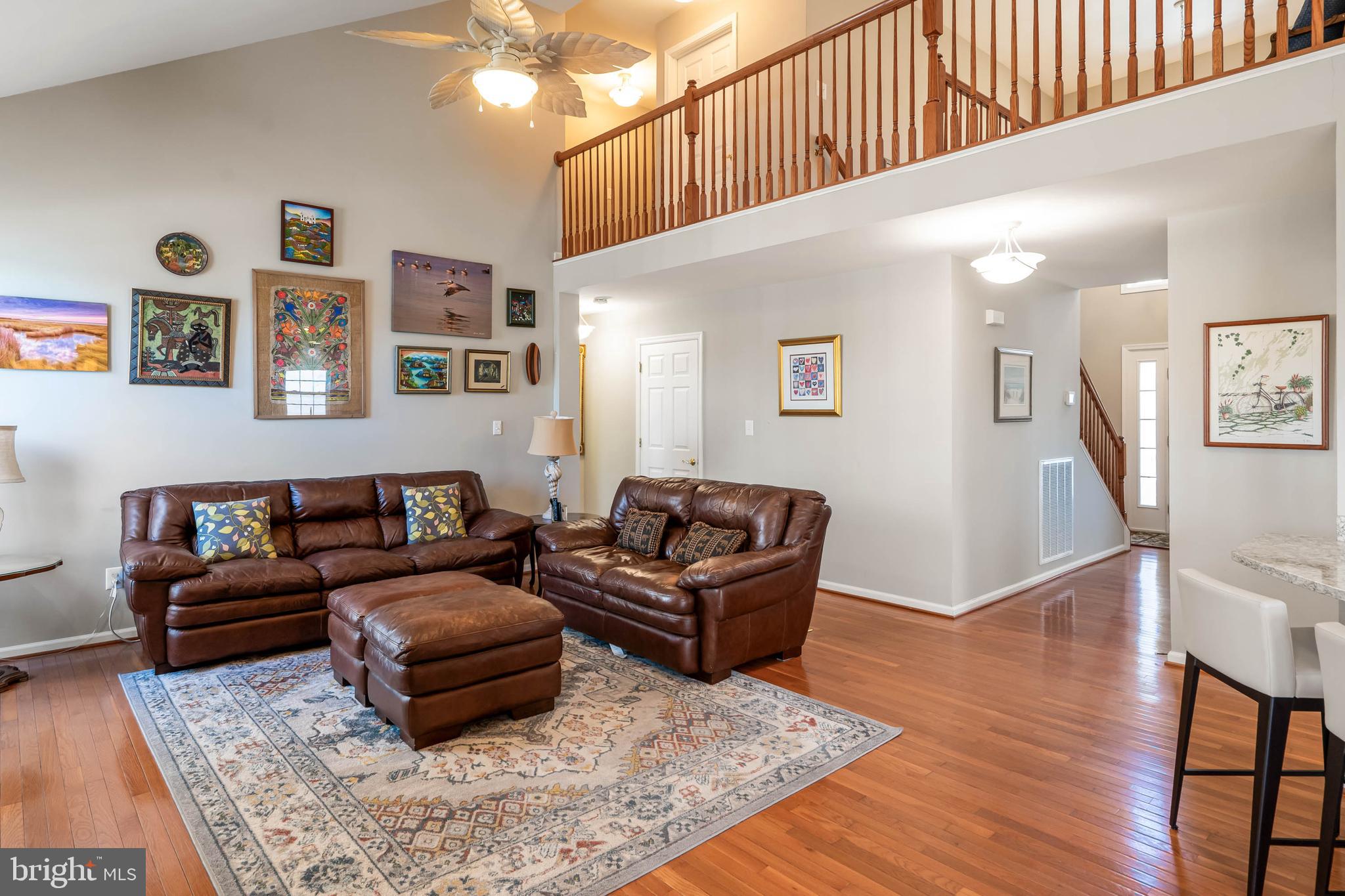 37140 Lord Baltimore Lane Ocean View, DE 19970 - Photo 16 of 56 a living room with furniture and wooden floor