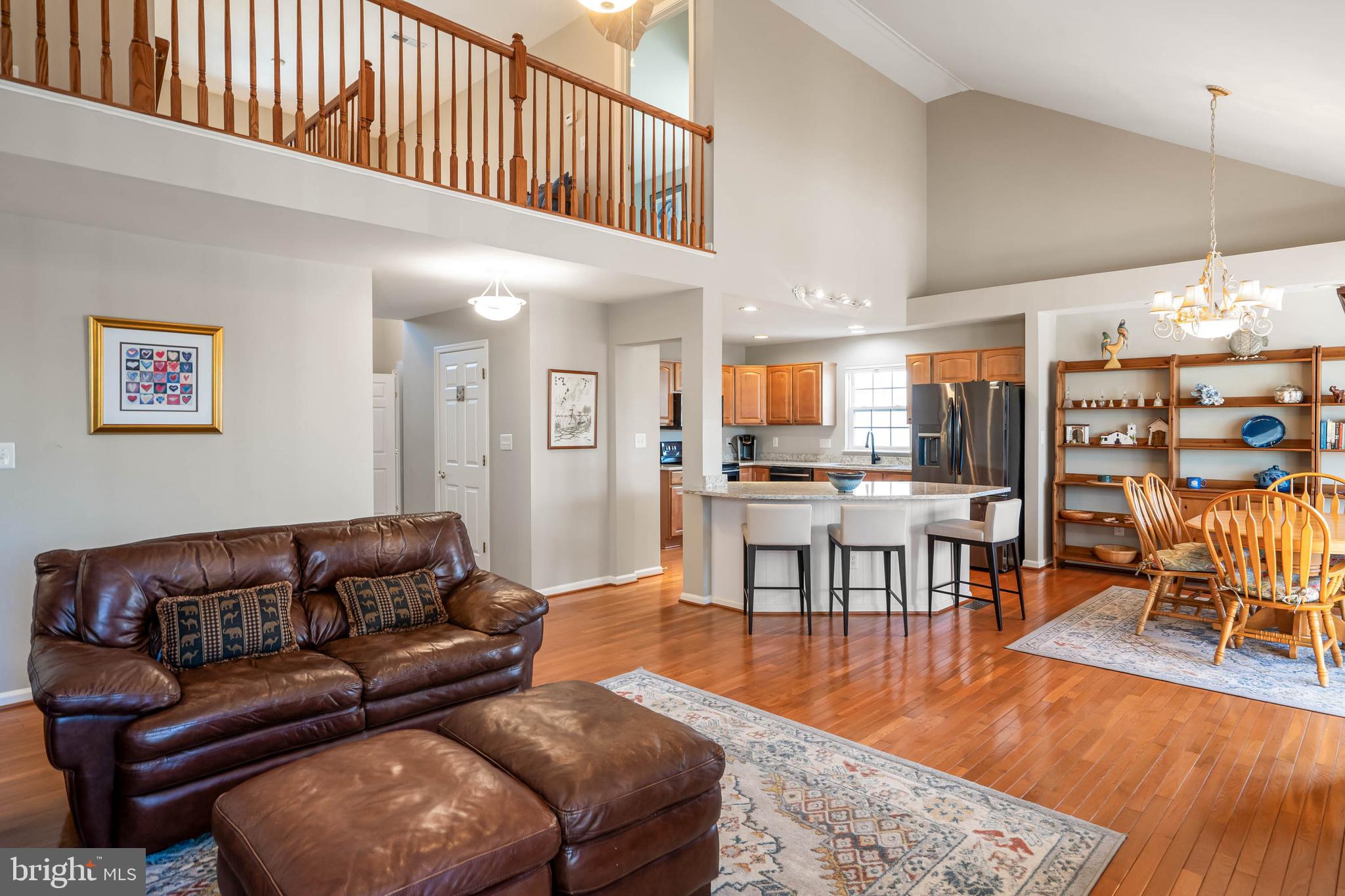 37140 Lord Baltimore Lane Ocean View, DE 19970 - Photo 17 of 56 a living room with furniture wooden floor and a large window