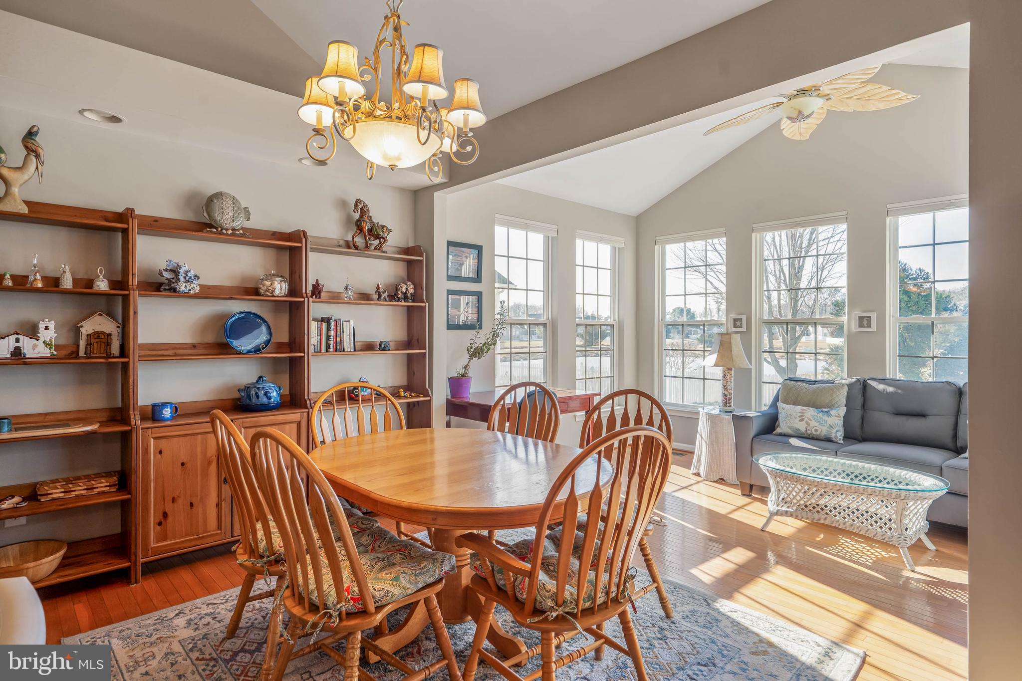 37140 Lord Baltimore Lane Ocean View, DE 19970 - Photo 18 of 56 a dining room with furniture a chandelier and a large window