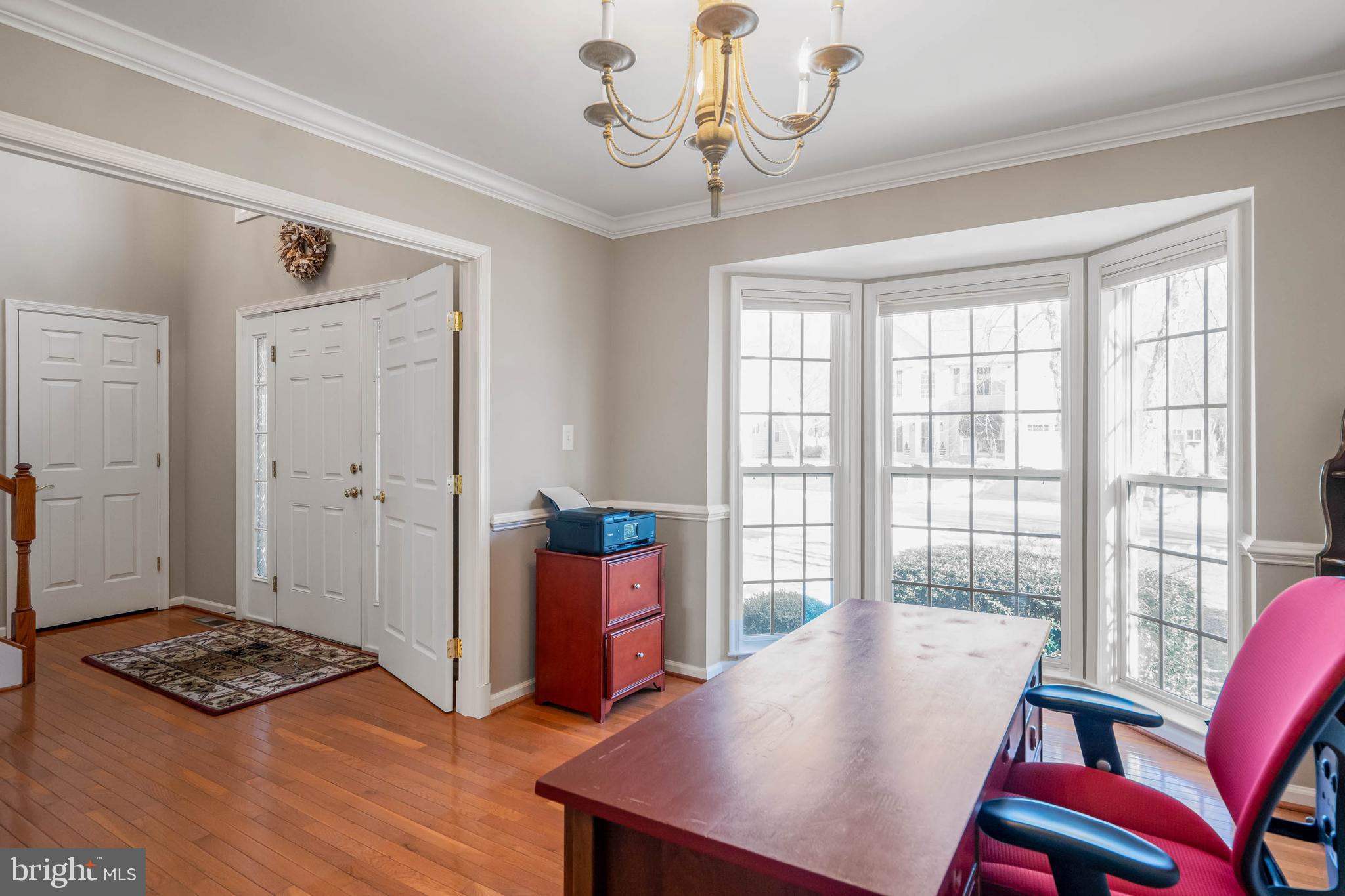 37140 Lord Baltimore Lane Ocean View, DE 19970 - Photo 26 of 56 a view of a dining room with furniture window and wooden floor