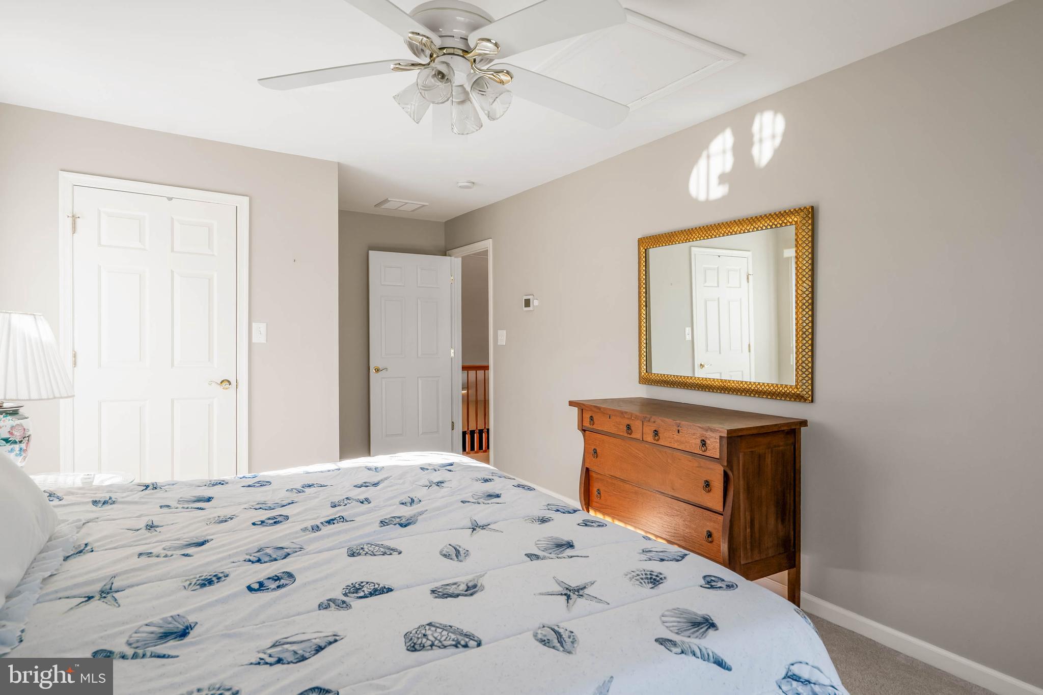 37140 Lord Baltimore Lane Ocean View, DE 19970 - Photo 30 of 56 a bedroom with a bed and a window