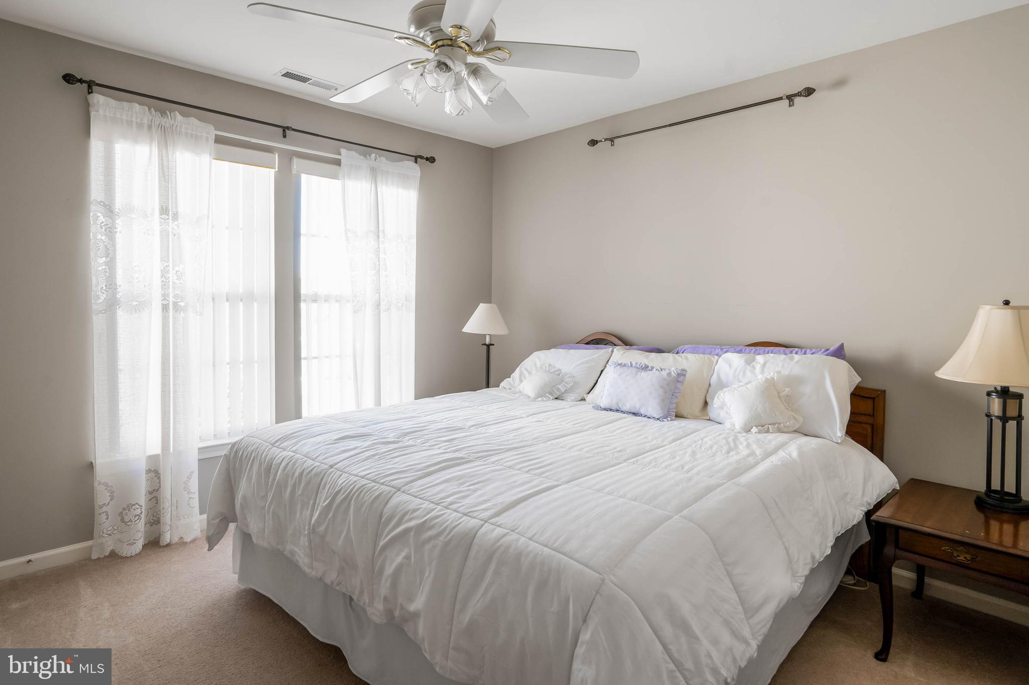 37140 Lord Baltimore Lane Ocean View, DE 19970 - Photo 31 of 56 a bedroom with a bed and a window
