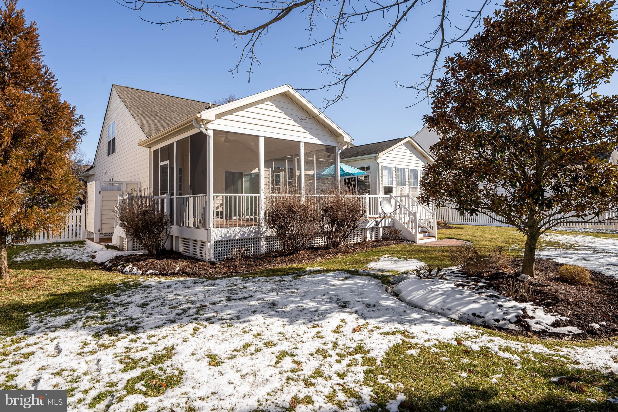37140 Lord Baltimore Lane Ocean View, DE 19970 - Photo 42 of 56 a front view of a house with a yard