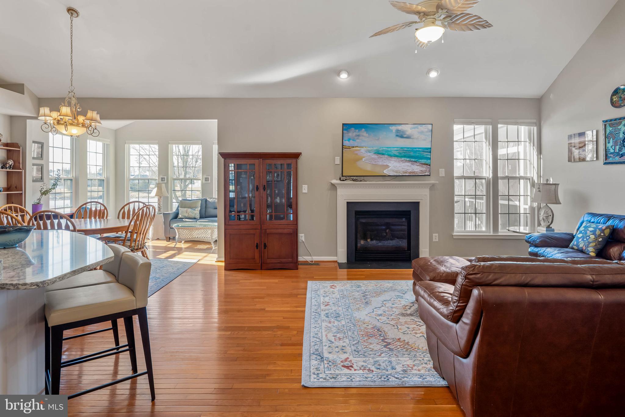 37140 Lord Baltimore Lane Ocean View, DE 19970 - Photo 8 of 56 a living room with furniture fireplace and flat screen tv