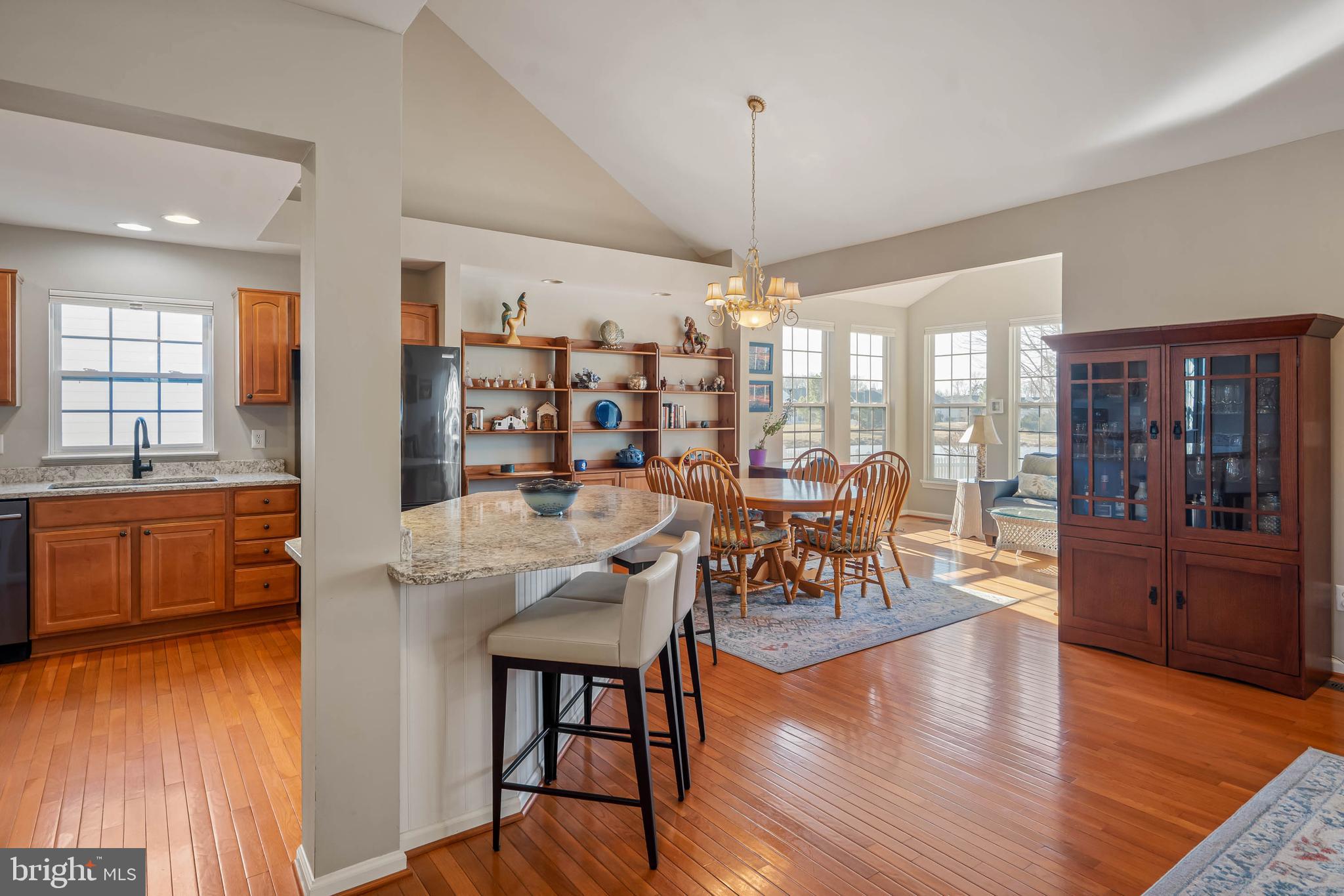 37140 Lord Baltimore Lane Ocean View, DE 19970 - Photo 9 of 56 a view of a dining room with furniture and wooden floor