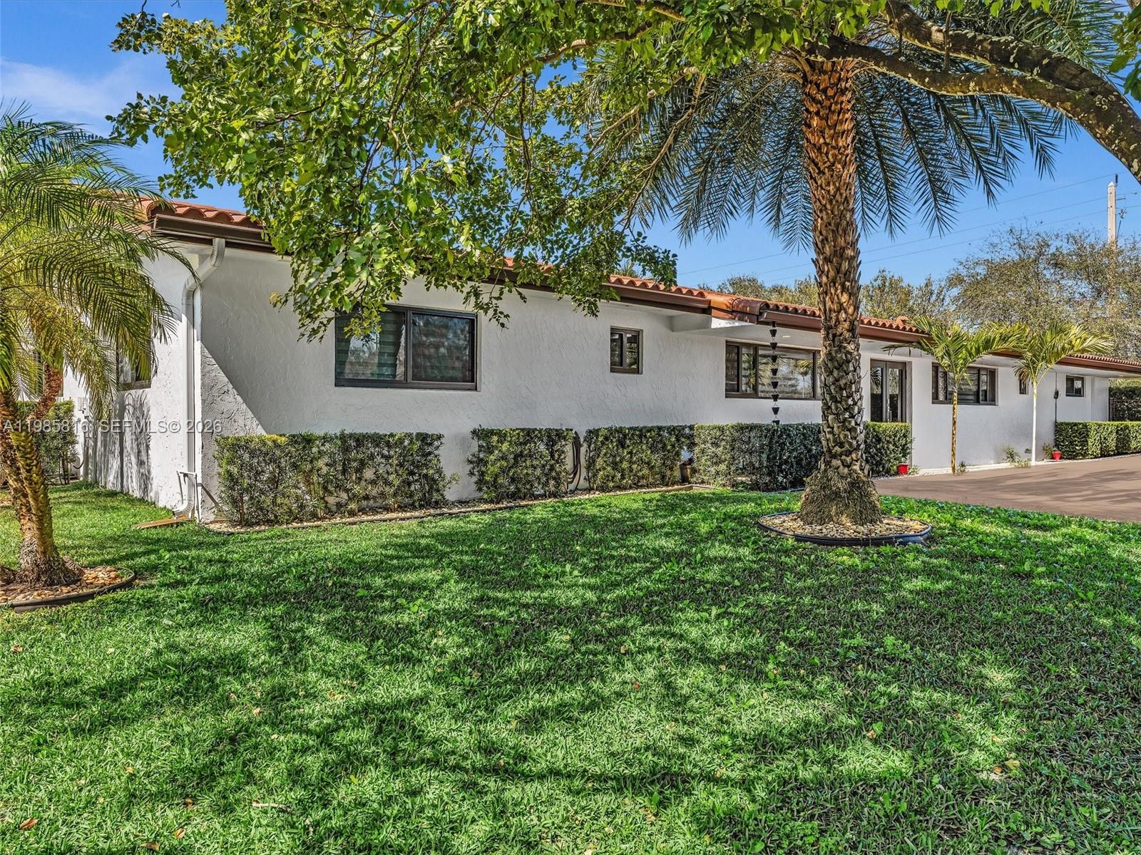 4501 Southwest 133rd Avenue Southwest Ranches, FL 33330 - Photo 13 of 100 a front view of a house with a garden