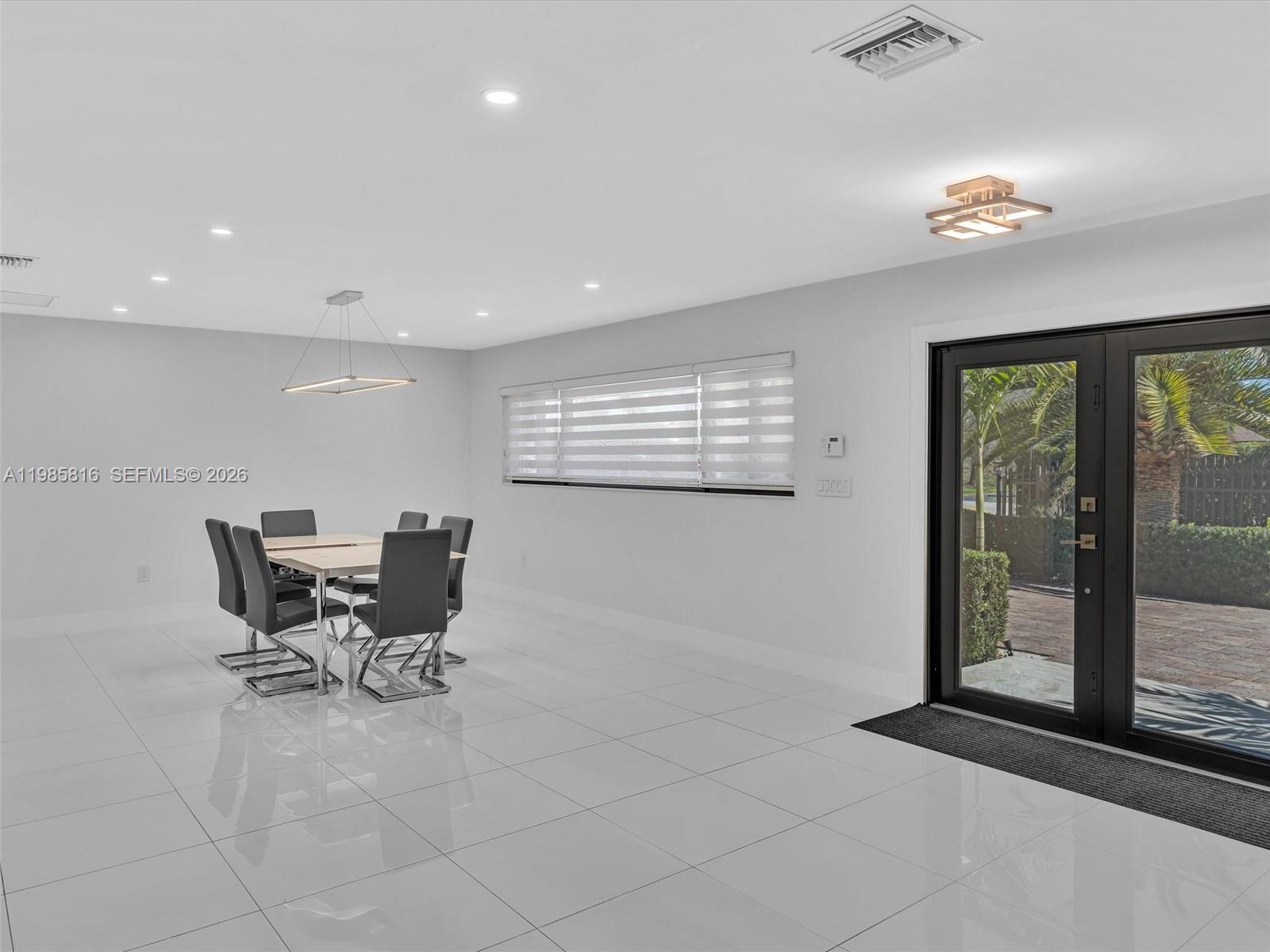 4501 Southwest 133rd Avenue Southwest Ranches, FL 33330 - Photo 20 of 100 a work room with furniture and large windows