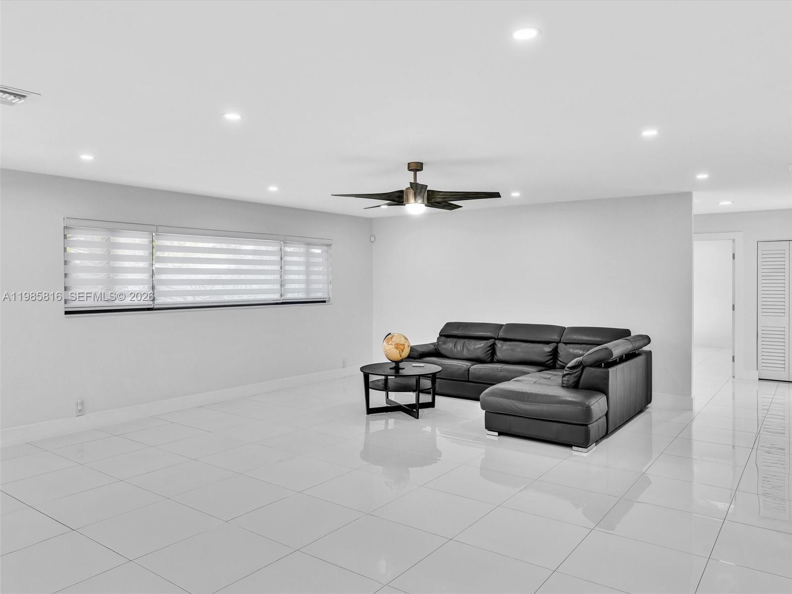 4501 Southwest 133rd Avenue Southwest Ranches, FL 33330 - Photo 24 of 100 a living room with furniture and a air conditioner vent