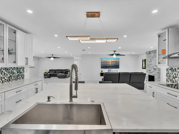 a spacious bathroom with a double vanity sink and mirror