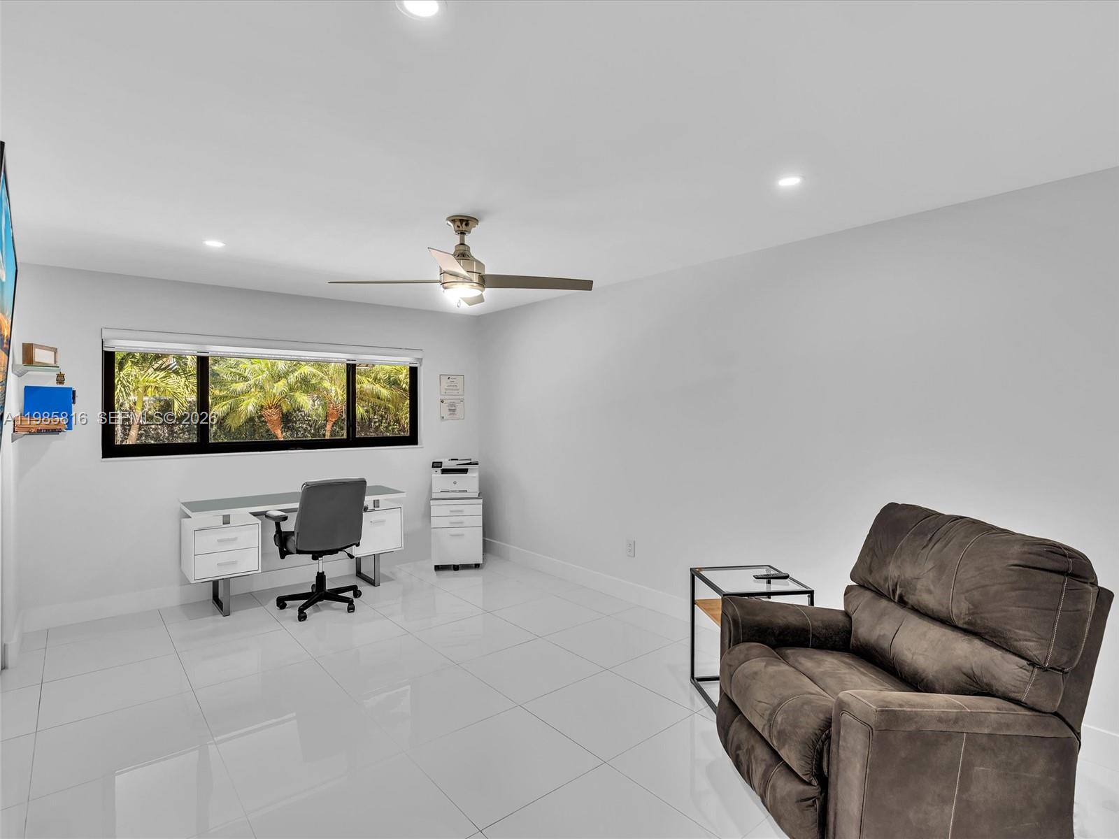 4501 Southwest 133rd Avenue Southwest Ranches, FL 33330 - Photo 48 of 100 a living room with furniture and a flat screen tv